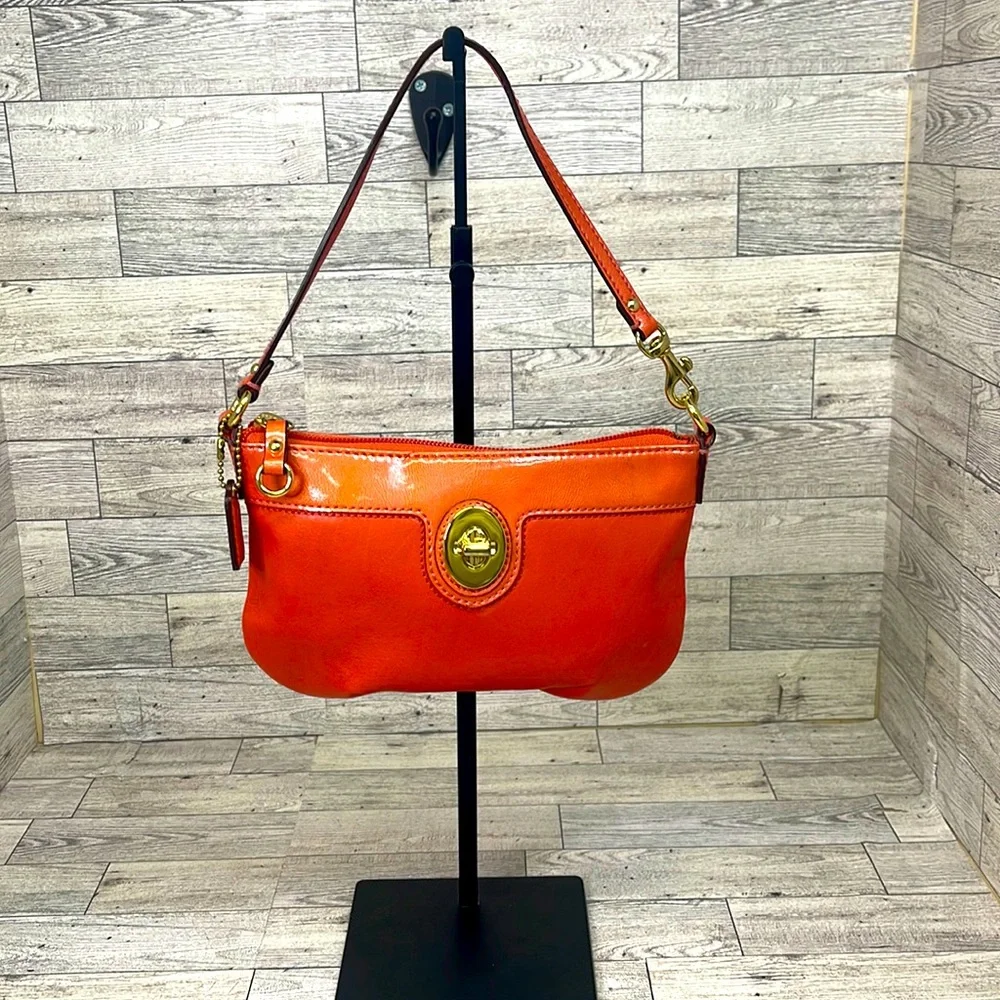 Coach wristlet coral leather with patent coral leather accent